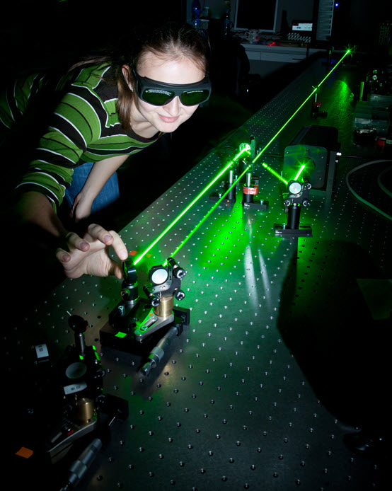 Female scientist doing research in an optical lab.